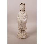 A Chinese blanc de chine figure of Quan Yin, impressed mark verso, 9½" high
