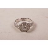 An 18ct white gold, diamond encrusted ring, approximate size 'M'