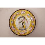 A Chinese enamelled copper saucer decorated with a red crowned crane and peaches, 4 character mark