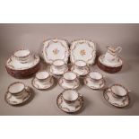 An eight place setting Minton Rose Pattern china tea set, largest plate 9" diameter, lacks teapot