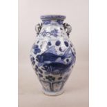A Chinese blue and white pottery vase with two kylin handles, decorated with carp in a lotus pond,