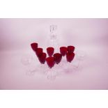 A set of nine ruby wine glasses with clear twist stems, 5¾" high, a pair of etched long stem wine
