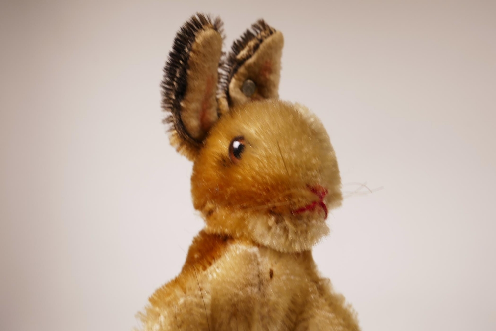 A 1952/53 Steiff begging rabbit, golden mohair, fixed limbs, brown and black glass eyes, red - Image 2 of 8