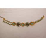 A gilt metal belt set with turquoise, cubic zirconium and green semi-precious stones, 41" long