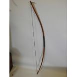 A hand crafted ash longbow, 58" long