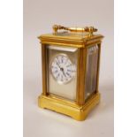 A miniature brass cased carriage clock, 2½" high