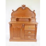 A teak Victorian style chiffonier with a carved upper section, 18" x 48", 64" high
