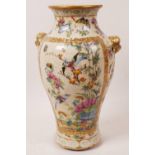 An unusual Chinese Canton famille rose porcelain vase decorated with birds and flowers in bright