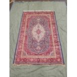 A blue ground Kashmir carpet with traditional medallion design, 77½" x 119"