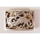 A Chinese white metal belt buckle with reticulated dragon decoration, impressed 2 character mark