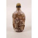 A Peking glass snuff bottle with carved decoration of children playing, 3½" high