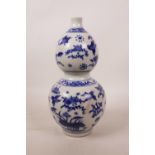 A Chinese blue and white porcelain double gourd vase decorated with birds and flowers, 9" high
