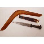 An African tribal dagger with wooden handle and leather sheath, 12" long, together with an