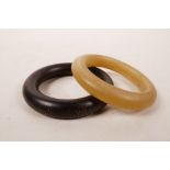 A faux horn bangle, and another, 3½" diameter