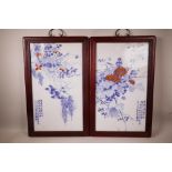 A pair of Chinese blue and white porcelain panels decorated with birds amongst branches in bloom