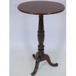 A C19th mahogany pedestal wine table with oval top on turned column and tripod supports, 30" high