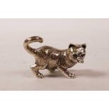 A sterling silver cat, with emerald eyes, 1½" long