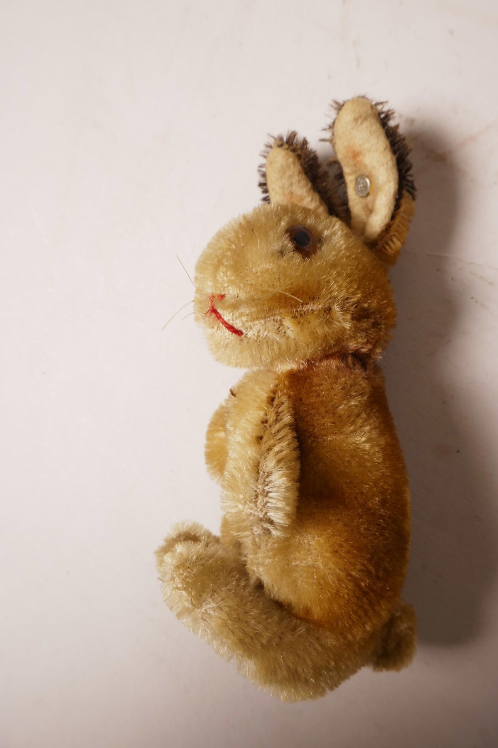 A 1952/53 Steiff begging rabbit, golden mohair, fixed limbs, brown and black glass eyes, red - Image 8 of 8