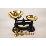 A set of cast iron and brass scales with bell weights, 11" wide