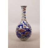 A Chinese blue and white porcelain pear shaped vase with kylin decoration and red highlights, 9"