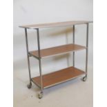 An aircraft folding three tier trolley with aluminium frame, on castors, 31½" high, 36" long, 13½"