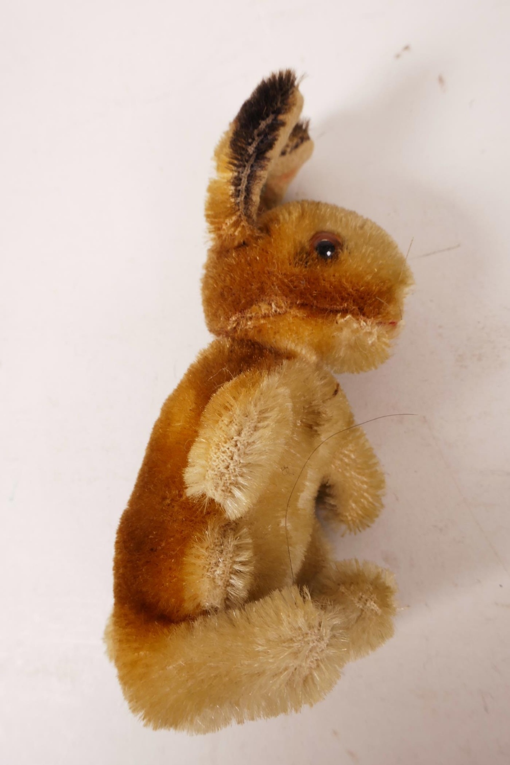 A 1952/53 Steiff begging rabbit, golden mohair, fixed limbs, brown and black glass eyes, red - Image 6 of 8