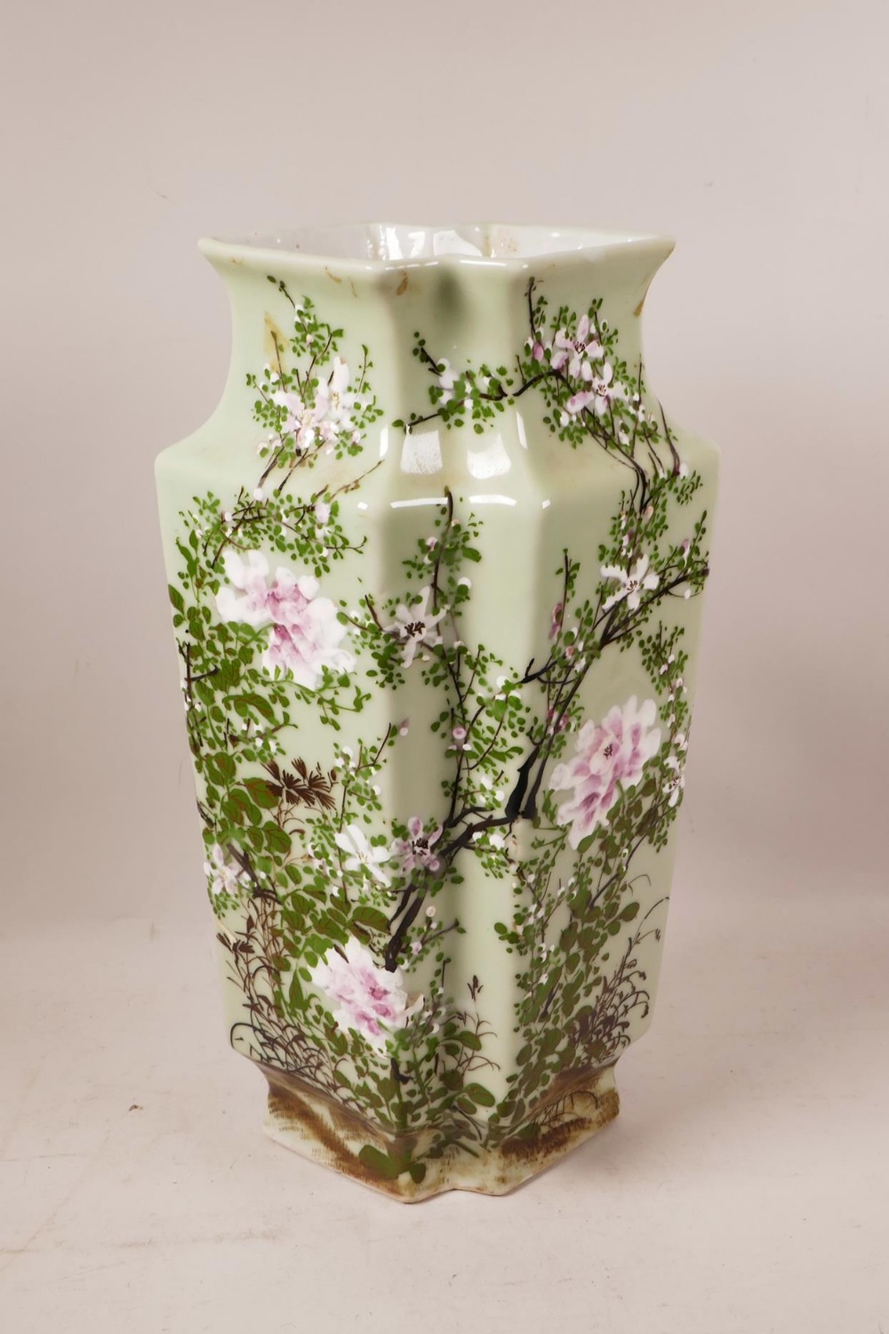 An Oriental celadon glazed vase, with raised enamel decoration of birds and blossom, 16" high