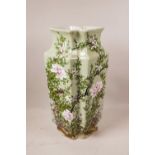 An Oriental celadon glazed vase, with raised enamel decoration of birds and blossom, 16" high