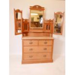 A Victorian satin walnut dressing table, the upper section with triptych mirrors and glass