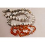 An agate bead necklace, 18" long, and a hardstone bead necklace, 25" long