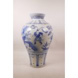 A Chinese blue and white Ming style meiping vase decorated with warriors in a landscape, 16" high