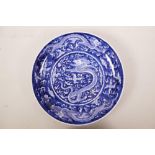 A Chinese blue and white porcelain dish with dragon and flaming pearl decoration, 6 character mark