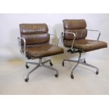 A pair of mid C20th Eames EA217 aluminium and leather upholstered office chairs