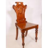 A mahogany hall chair with scrolling decoration, 34½" high