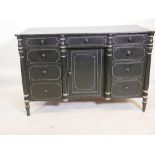 An early C19th painted pine kneehole desk, with cup corner top and nine drawers flanking a central