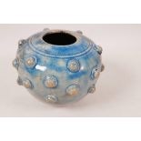 An Oriental blue glazed porcelain vase with raised, studded decoration, 4½" high