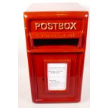 A metal postbox with cast iron front panel and door, 17½" high, 9½" wide, 10½" wide