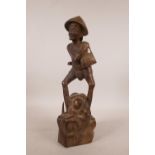 A Japanese carved wood figure of a farmer, A/F, 14" high