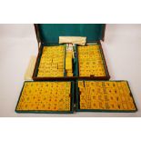 A vintage mahjong set in a leather case