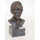 A bronze bust of a gentleman, mounted on a marble base, 10" high