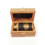 A brass cased and leather bound Victorian style marine telescope in a hardwood box, 3" long