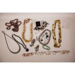 A collection of assorted costume jewellery to include a quantity of 925 silver mounted rings and