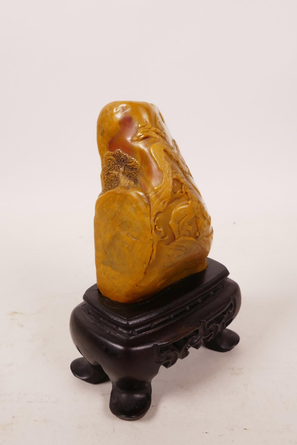 A Chinese soapstone carving of figures in a landscape, on a hardwood stand, 4" high - Image 2 of 4