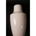 A white glazed high fired Ruskin pottery vase, 8" high