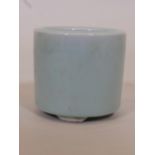 A Chinese celadon glazed ceramic brush pot, seal mark to base, 4" high