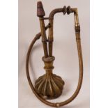 A vintage Persian brass hookah, the body in the shape of a gourd, with wire wound hose, 17½" high