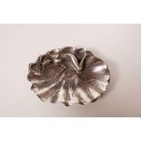 A Chinese white metal trinket dish in the form of a lily pad with a sleeping female nude, 4