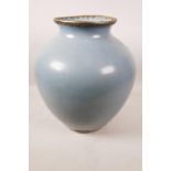 A large Chinese duck egg blue glazed pottery jar with brass mounts, 13½" high