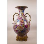 A large Chinese polychrome porcelain vase with ormolu style mounts and handles, the body with all