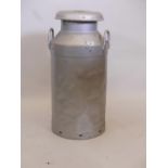 A galvanised milk churn and cover, 29" high